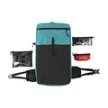 Teal ADC Pack backpack shown with zip pouch Large, Zip Pouch Small, Shower Cap Orange.