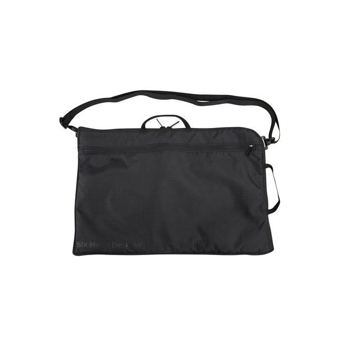 Back of the Black Laptop Sleeve with a strap on a white background with the Six Moon Designs Logo