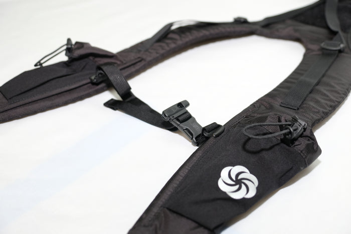 Close up of the Side pocket and the sternum strap on the Shoulder Strap on a white background.