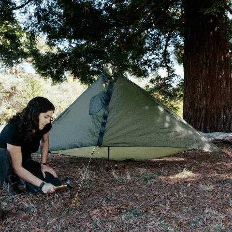 Gatewood Cape setup gif showing the setup and then transitioning to being worn by a woman in the woods.