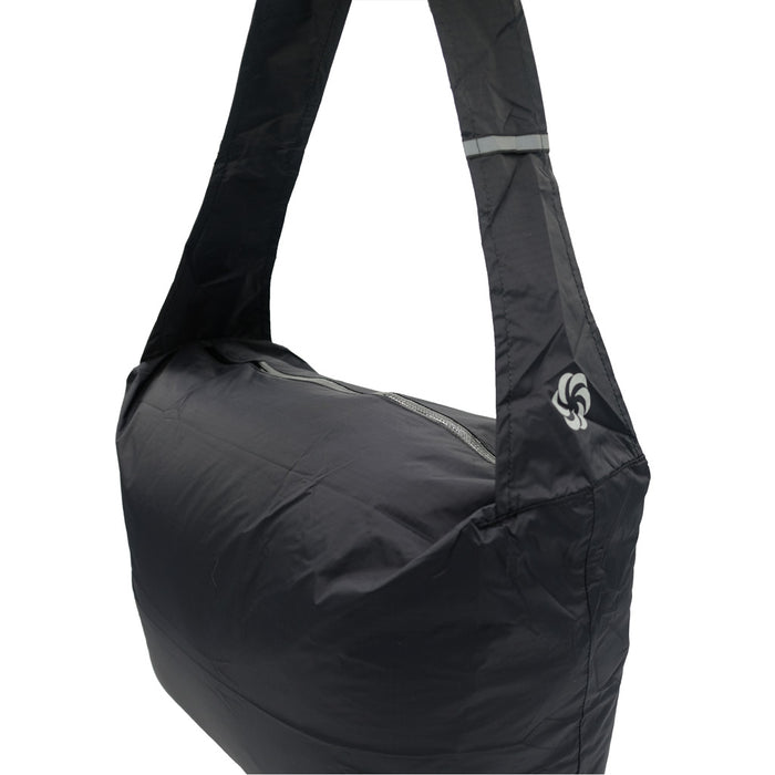 Grocery Go Getter in Black stuffed and showing the Six Moon Designs logo on the strap