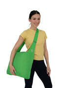 Green Grocery Go Getter being worn by a woman in a cross body position