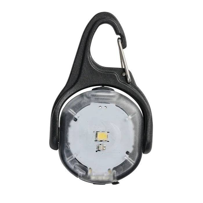 Nite Ize Moonlit Rechargeable Micro lantern laying on a flat white surface.